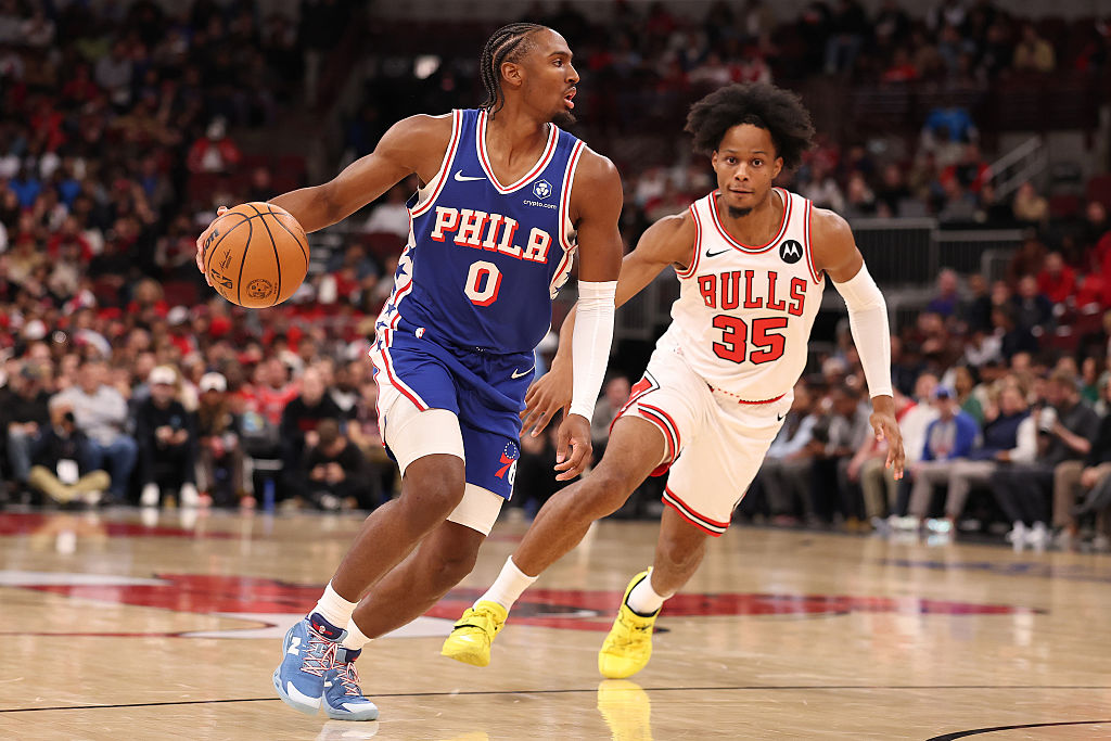 CHICAGO, ILLINOIS - NOVEMBER 04: Tyrese Maxey #0 of the Philadelphia 76ers drives to the basket past Isaac Okoro #35 of the Chicago Bulls during the first half at the United Center on November 04, 2025 in Chicago, Illinois.