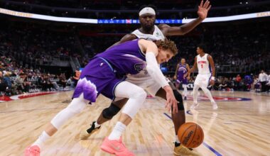 Lauri Markkanen #23 of the Utah Jazz tries to get around the defense of Isaiah Stewart #28 of the D...