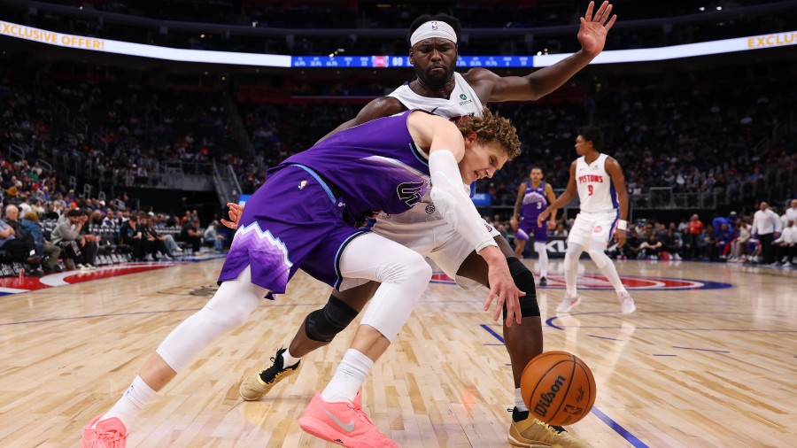 Lauri Markkanen #23 of the Utah Jazz tries to get around the defense of Isaiah Stewart #28 of the D...