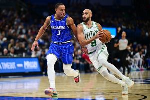 ORLANDO, FLORIDA - NOVEMBER 09: Derrick White #9 of the Boston Celtics drives against Desmond Bane #3 of the Orlando Magic in the first half at Kia Center on November 09, 2025 in Orlando, Florida. NOTE TO USER: User expressly acknowledges and agrees that, by downloading and or using this photograph, User is consenting to the terms and conditions of the Getty Images License Agreement. (Photo by Julio Aguilar/Getty Images)