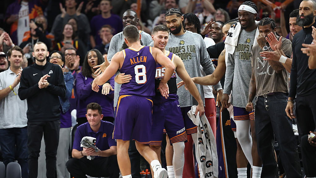 Grayson Allen #8 of the Phoenix Suns celebrates with Collin Gillespie #12 after hitting a three-poi...