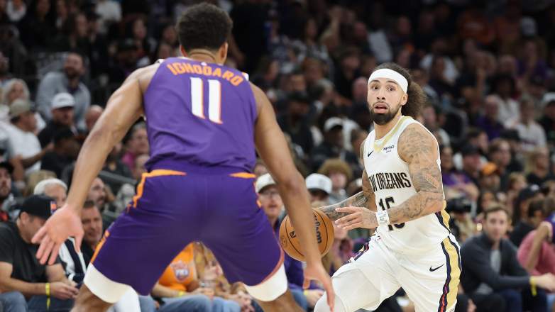 New Orleans Pelicans guard Jose Alvarado dribbles past Phoenix Suns guard Devin Booker
