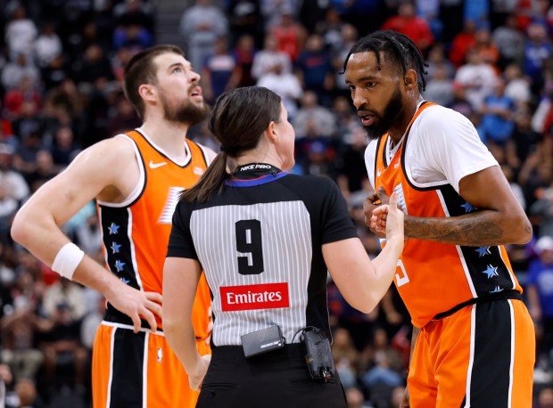 Clippers forward Derrick Jones Jr., right, argues his foul with...