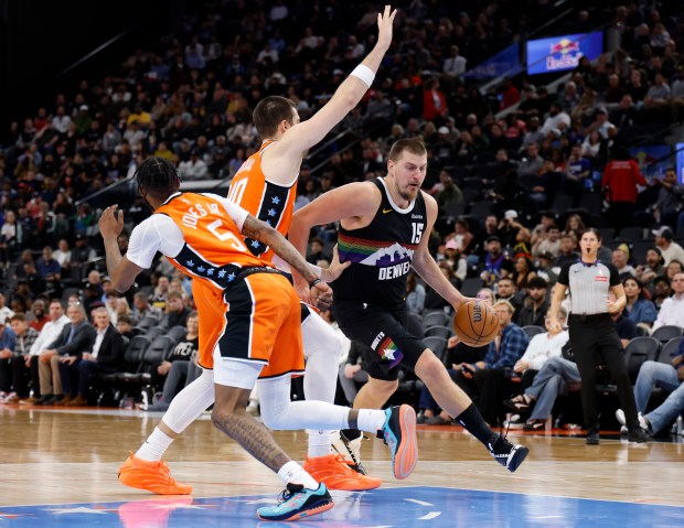 Denver Nuggets center Nikola Jokic drives to the basket in...