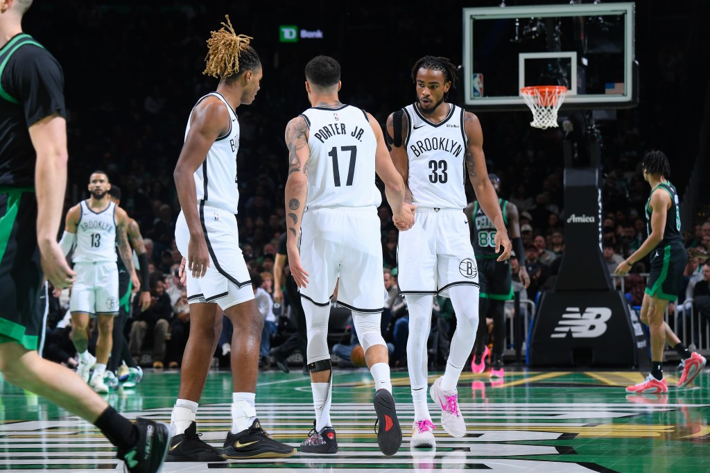  Nic Claxton #33 and Michael Porter Jr. #17 of the Brooklyn Nets high five during the game against the Boston Celtics during the 2025-26 Emirates Cup on November 21, 2025 at TD Garden in Boston, Massachusetts. 