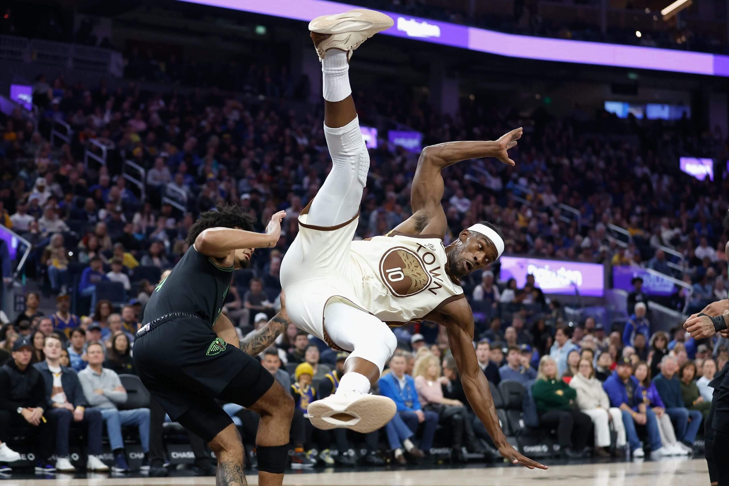 Jimmy Butler falls awkwardly in a game against the Pelicans.