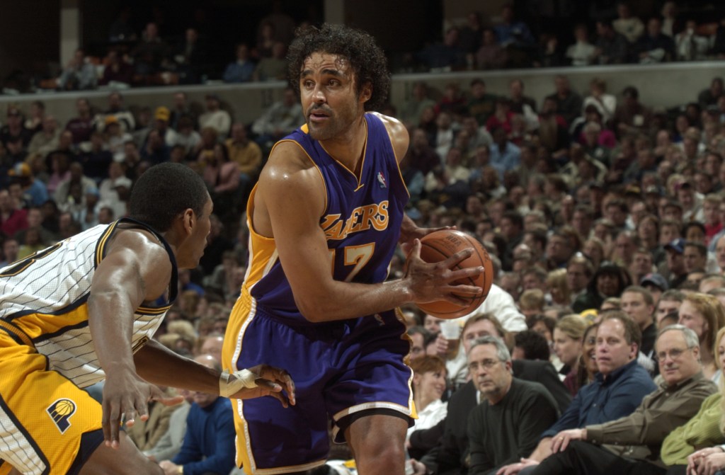 Rick Fox #17 of the Los Angeles Lakers holds the ball as he is covered by Ron Artest #23 of the Indiana Pacers during the game at Conseco Fieldhouse on February 2, 2004 in Indianapolis, Indiana. 