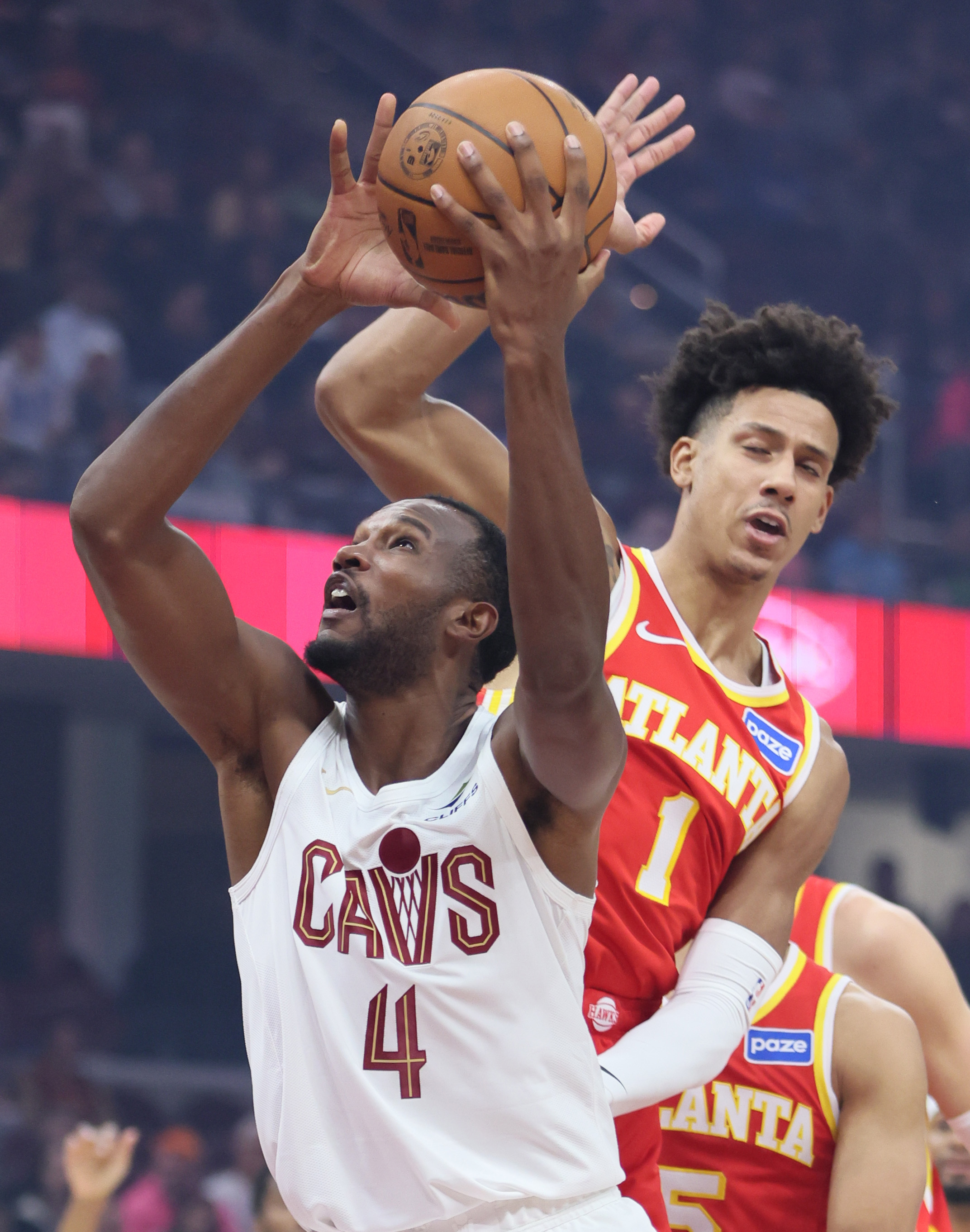 Cleveland Cavaliers center Evan Mobley drives to the basket for a score guarded by Atlanta Hawks forward Jalen Johnson in the first half at Rocket Arena. 