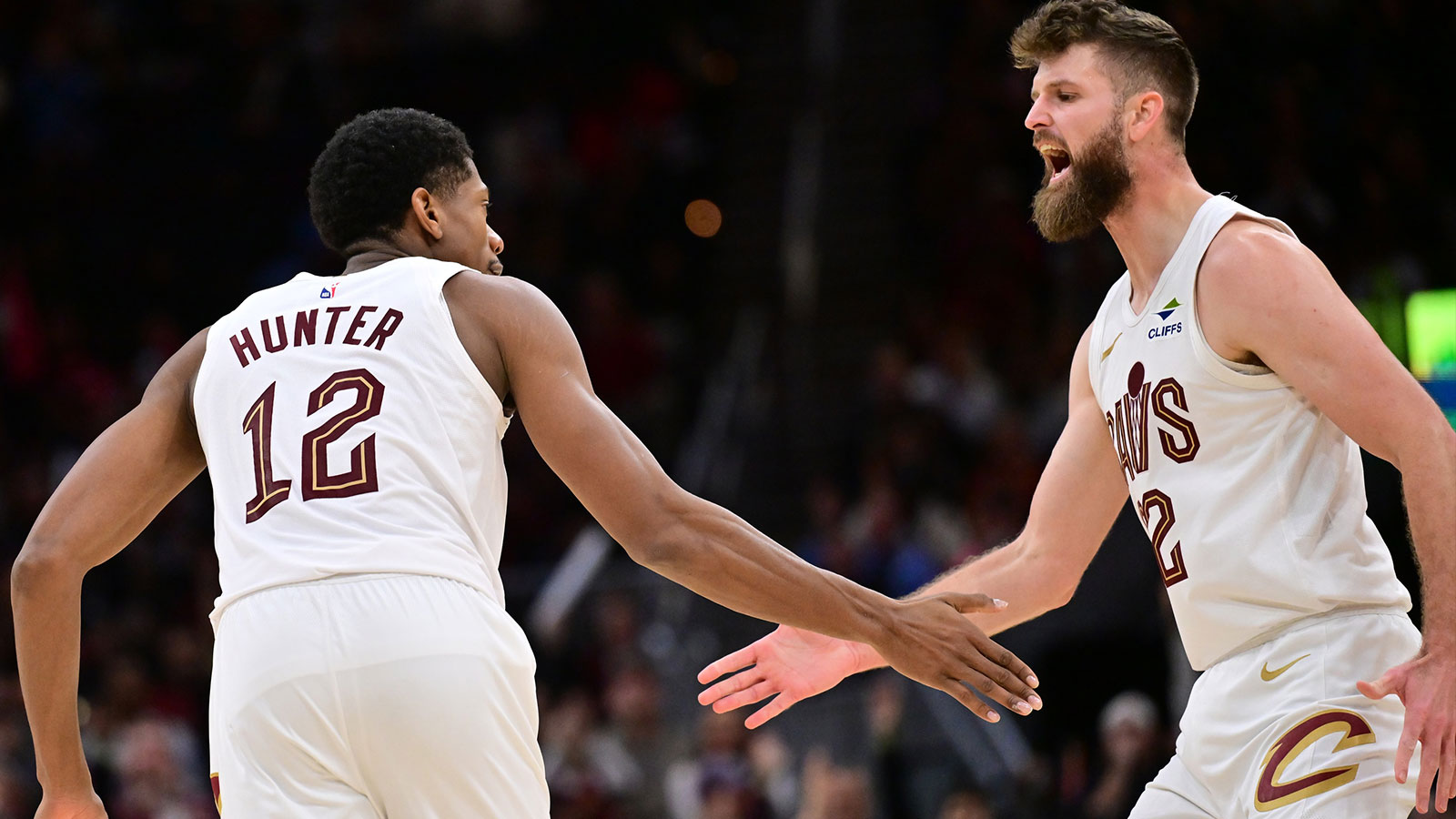 Cavaliers forward De'Andre Hunter (12) celebrates with forward Dean Wade (32) during the second half against the Atlanta Hawks at Rocket Arena
