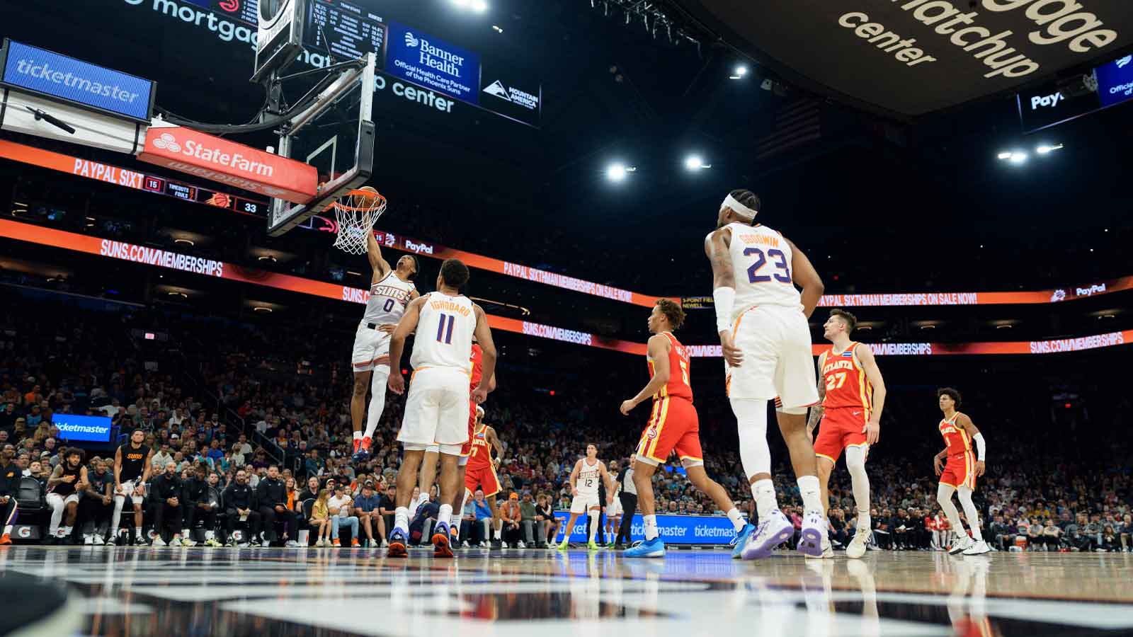 Phoenix Suns forward Ryan Dunn (0) drives and dunks against the Atlanta Hawks during the first half of a game at at Mortgage Matchup Center.