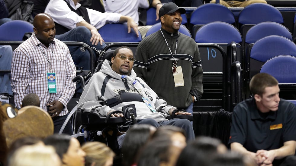 Former Wake Forest and Philadelphia 76ers player Rodney Rogers, center, watches during the...