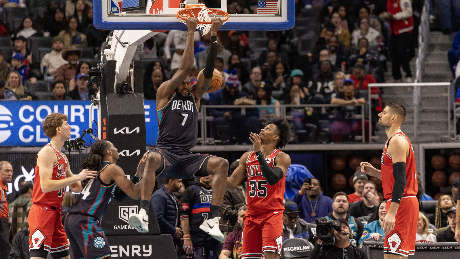 Detroit Pistons forward Paul Reed (7) dunks the ball next to Chicago Bulls forward Isaac Okoro (35) during the second half at Little Caesars Arena.