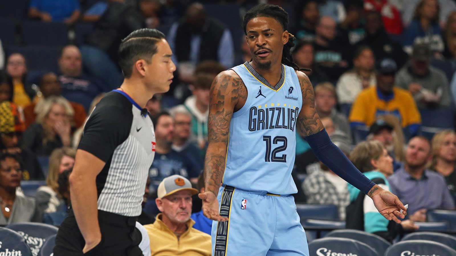 Memphis Grizzlies guard Ja Morant (12) reacts toward an official during the first quarter against the Dallas Mavericks at FedExForum.