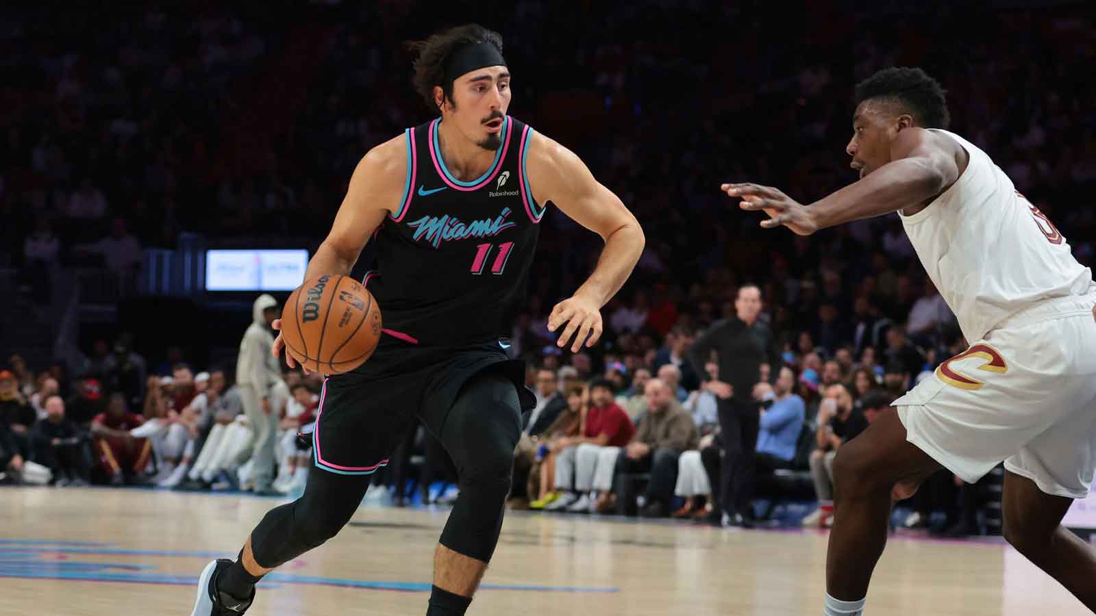 Miami Heat forward Jaime Jaquez Jr. (11) drives to the basket against Cleveland Cavaliers center Thomas Bryant (3) during the fourth quarter at Kaseya Center. 