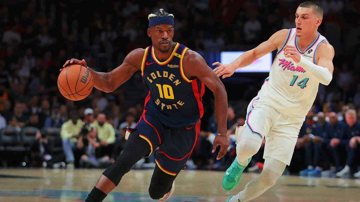 Golden State Warriors forward Jimmy Butler III (10) drives to the basket past Miami Heat guard Tyler Herro (14) during the first quarter at Kaseya Center.