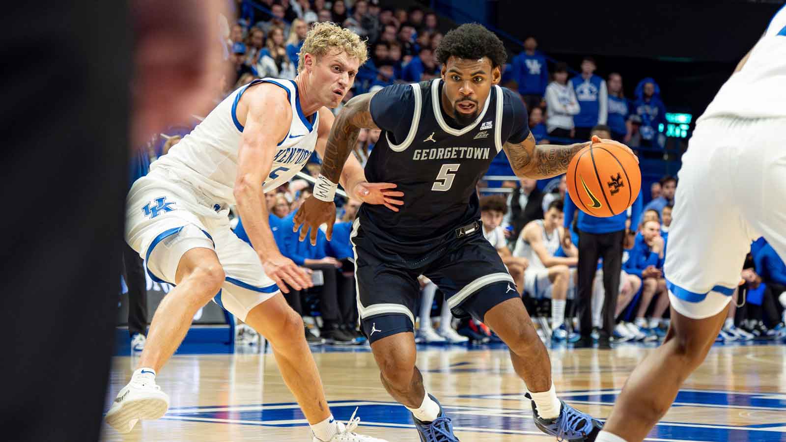 Georgetown’s KJ Lewis (5) drove to the basket for a score as the Kentucky Wildcats host the Georgetown Hoyas at Rupp Arena in Lexington on Thursday, Oct. 30, 2025.
