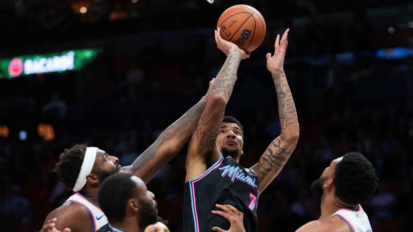 Miami Heat center Kel'el Ware (7) shoots the basketball against New York Knicks center Karl-Anthony Towns (32) during the first quarter at Kaseya Center. 