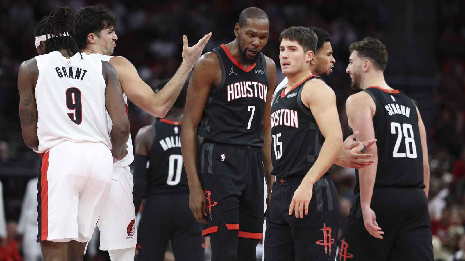 Houston Rockets forward Kevin Durant (7) talks with guard Reed Sheppard (15) during the fourth quarter against the Portland Trail Blazers at Toyota Center.