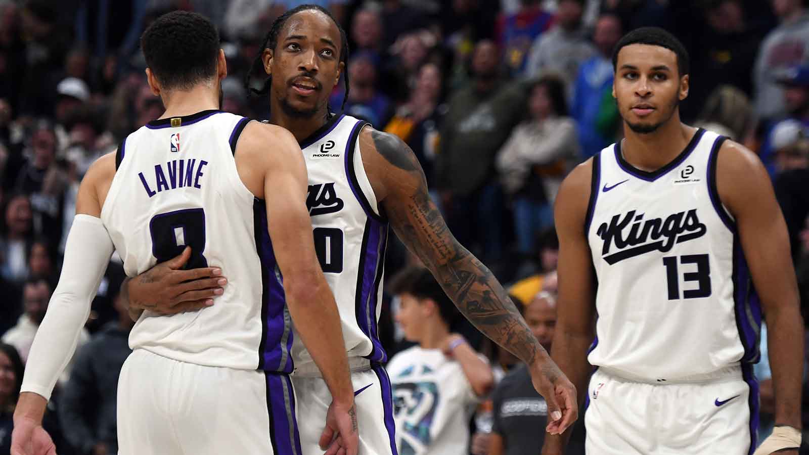 Sacramento Kings guard DeMar DeRozan (10) celebrates with guard Zach LaVine (8) after a made shot late in the second half of a win against the Denver Nuggets at Ball Arena.