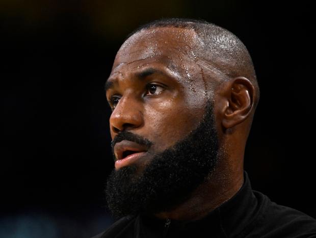 Lakers star LeBron James looks on before their game against...