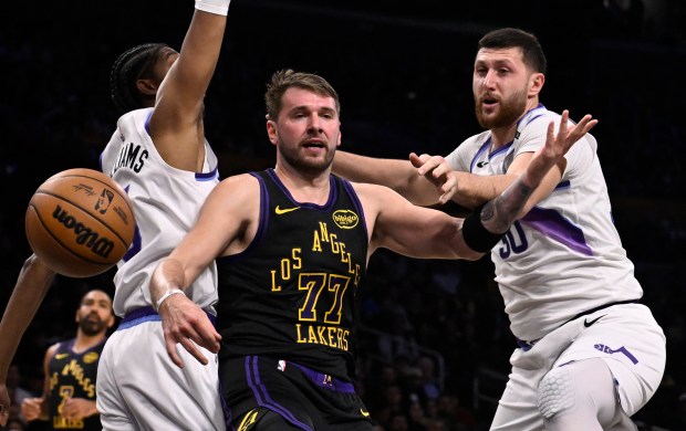 Lakers star Luka Doncic loses the ball as he drives...