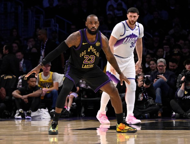 Lakers star LeBron James defends as Utah Jazz center Jusuf...