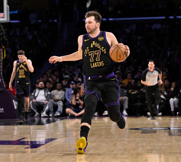 Lakers star Luka Doncic handles the ball during the first...