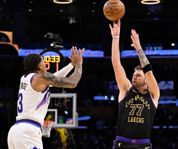 Lakers star Luka Doncic shoots as the Utah Jazz’s Keyonte...