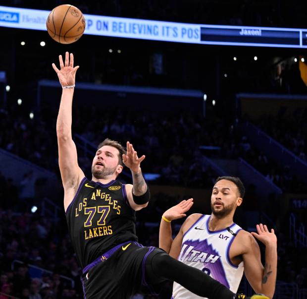 Lakers star Luka Doncic shoots in front of the Utah...