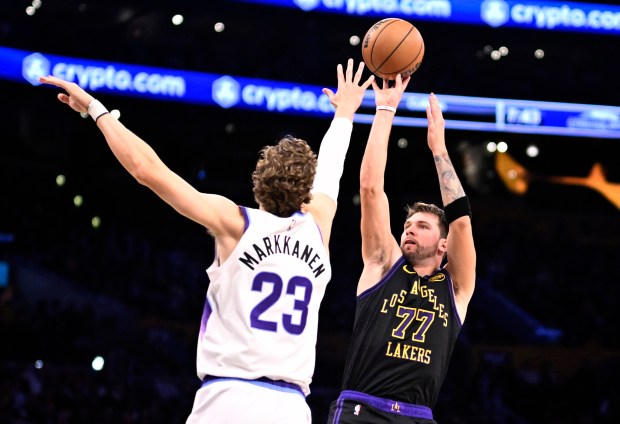 Lakers star Luka Doncic shoots as Utah Jazz forward Lauri...