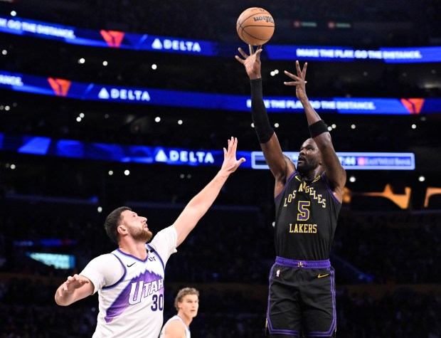 Lakers center Deandre Ayton shoots as Utah Jazz center Jusuf...