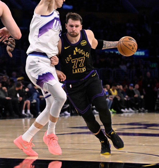 Lakers star Luka Doncic drives to the basket during the...