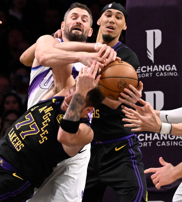 Utah Jazz forward Kevin Love (42) fouls Lakers star Luka...