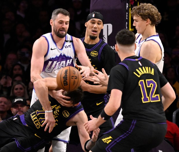 Utah Jazz forward Kevin Love (42) fouls Lakers star Luka...