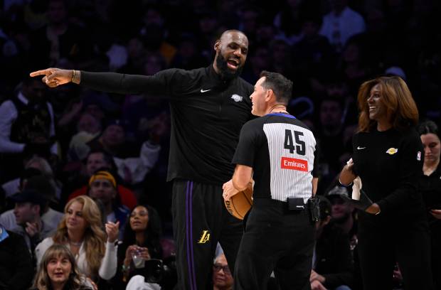 Lakers star LeBron James reacts toward an official during the...