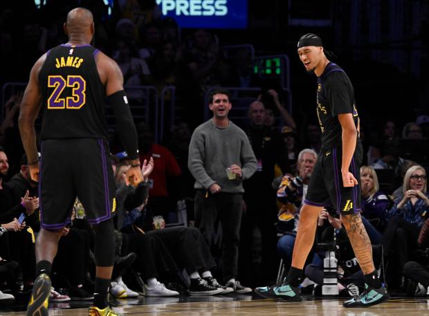 Lakers center Jaxson Hayes, right, reacts after a basket as...