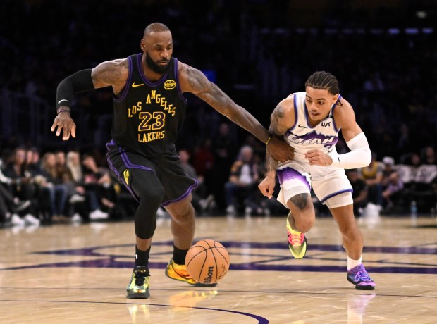 Lakers star LeBron James, left, and the Utah Jazz’s Keyonte...