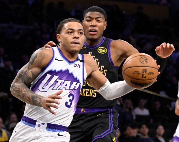 The Utah Jazz’s Keyonte George drives to the basket past...