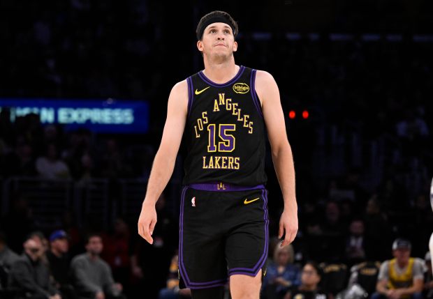 Lakers guard Austin Reaves walks down the court during the...
