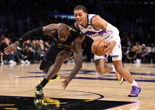 Lakers star LeBron James, left, and the Utah Jazz’s Keyonte...