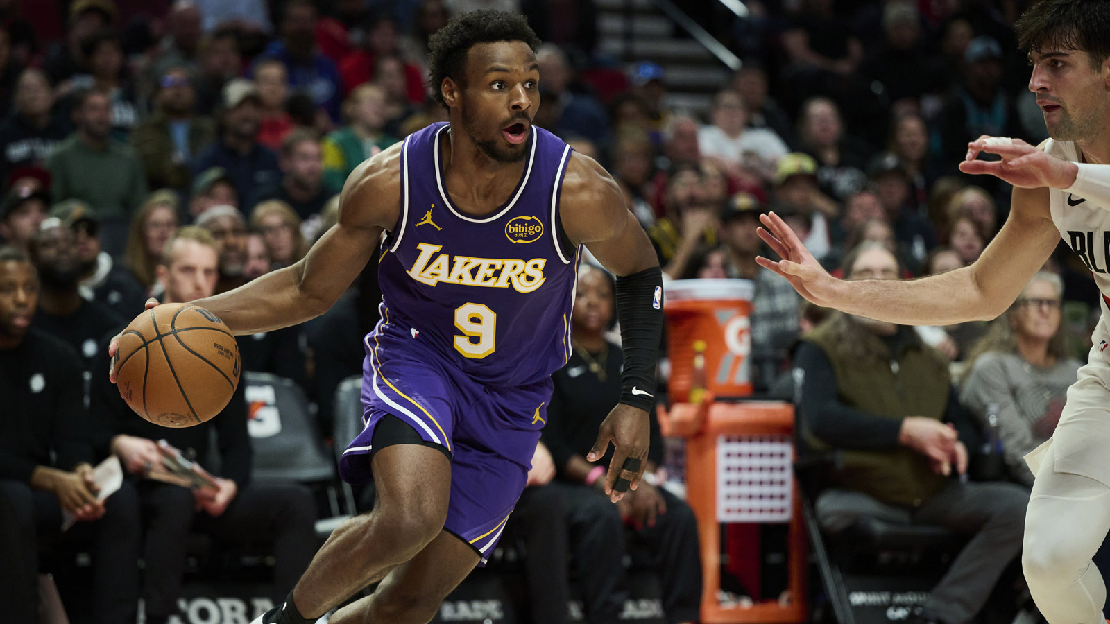 Lakers guard Bronny James (9) drives to the basket during the second half against Portland Trail Blazers forward Deni Avdija (8) at Moda Center