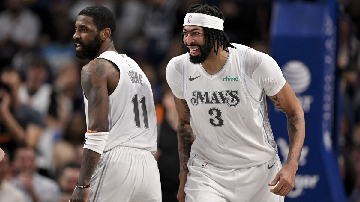Mavericks forward Anthony Davis (3) and guard Kyrie Irving (11) celebrates after Davis dunks the ball during the game between the Dallas Mavericks and the Houston Rockets at the American Airlines Center
