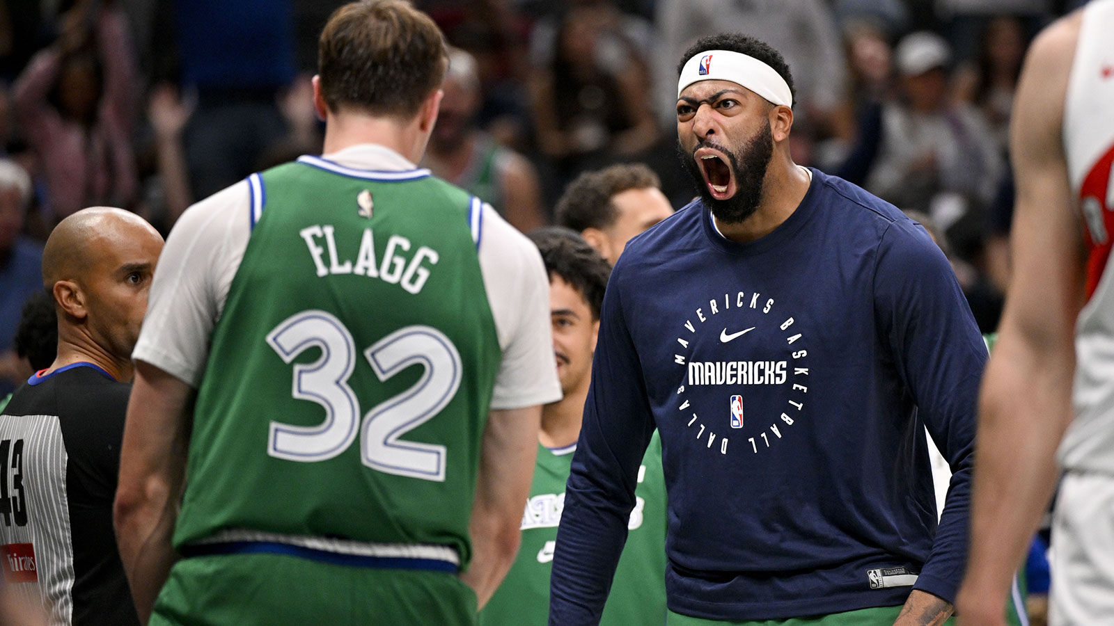 Mavericks forward Cooper Flagg (32) and forward Anthony Davis (3) celebrates after Flagg dunks the ball against the Toronto Raptors during the third quarter at the American Airlines Center