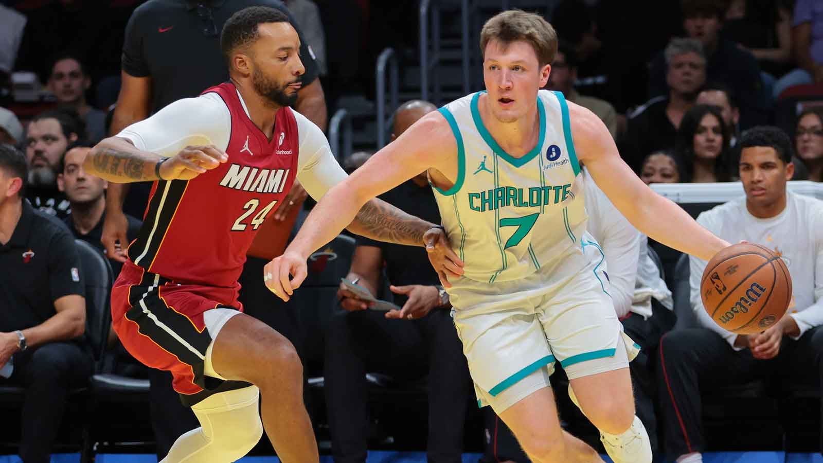 Miami Heat guard Pelle Larsson (9) reacts after scoring against the Charlotte Hornets during the first quarter of an NBA Cup game at Kaseya Center.