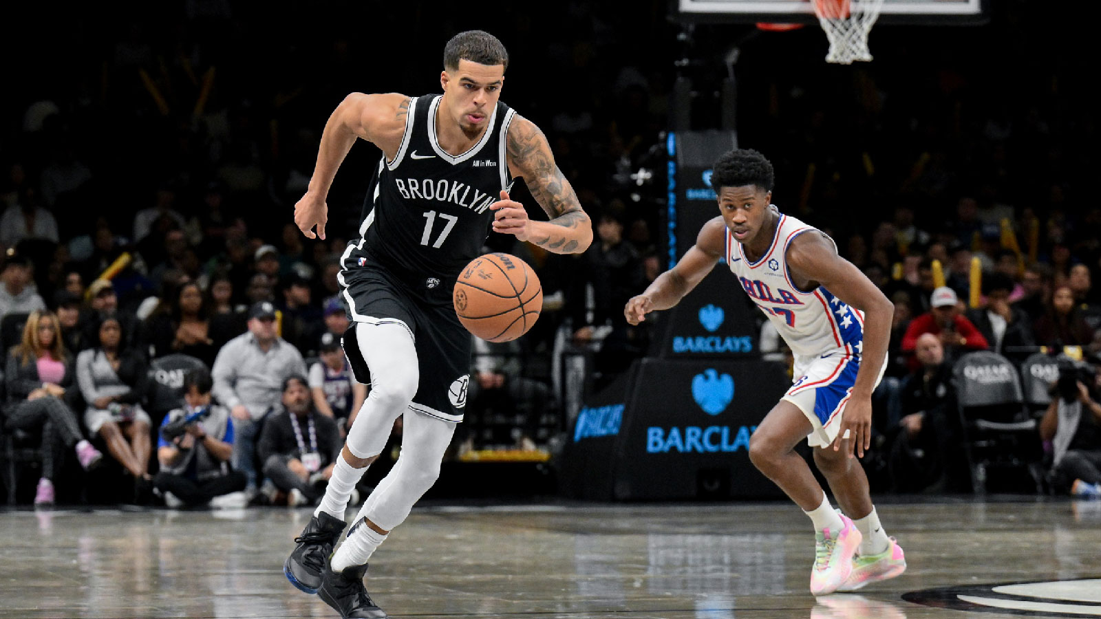 Nov 2, 2025; Brooklyn, New York, USA; Brooklyn Nets forward Michael Porter Jr. (17) leads a fast break as Philadelphia 76ers guard VJ Edgecombe (77) pursues during the second half at Barclays Center. Mandatory Credit: John Jones-Imagn Images