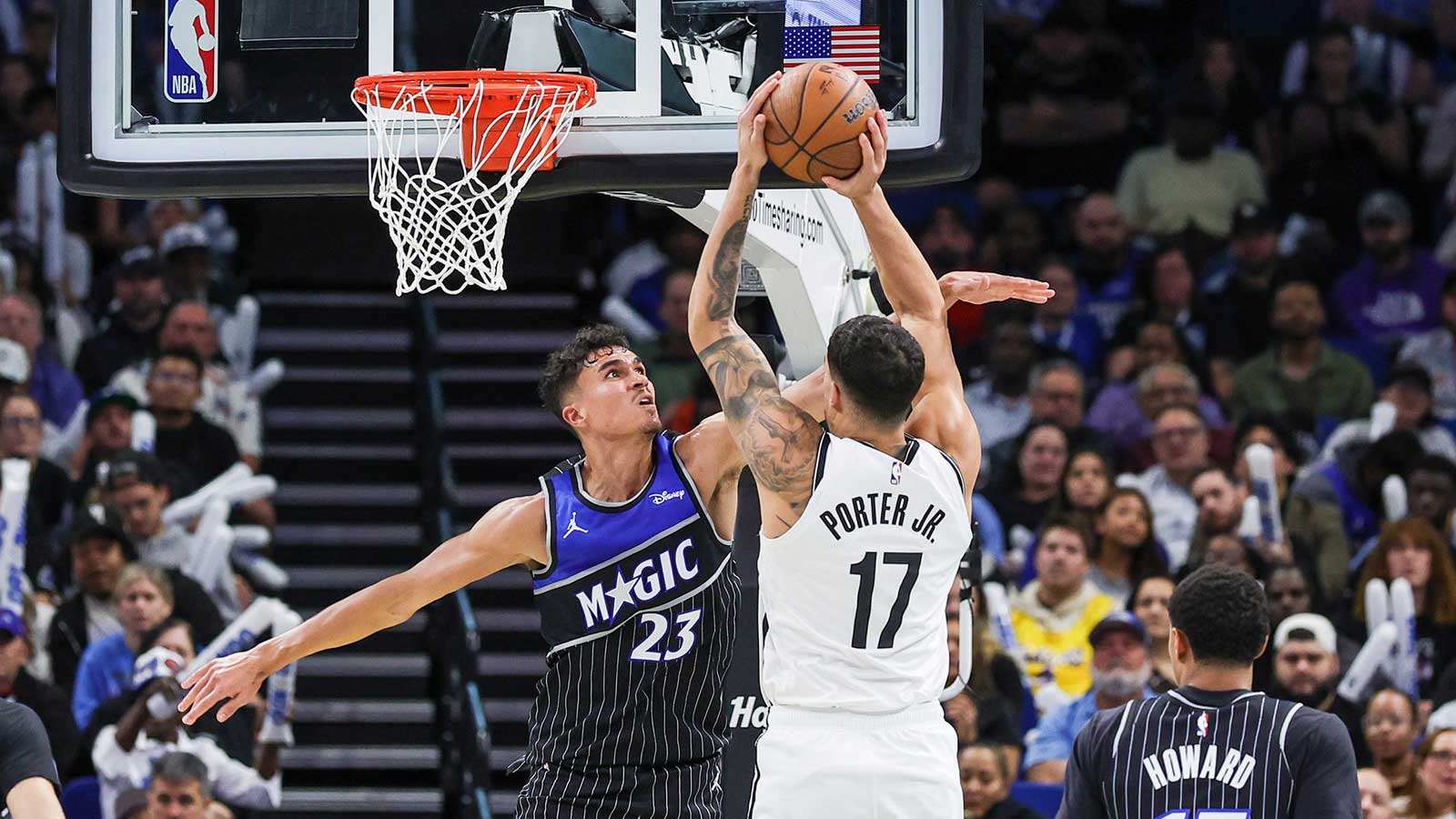 Brooklyn Nets forward Michael Porter Jr. (17) is fouled by Orlando Magic forward Tristan da Silva (23) during the second half at Kia Center.