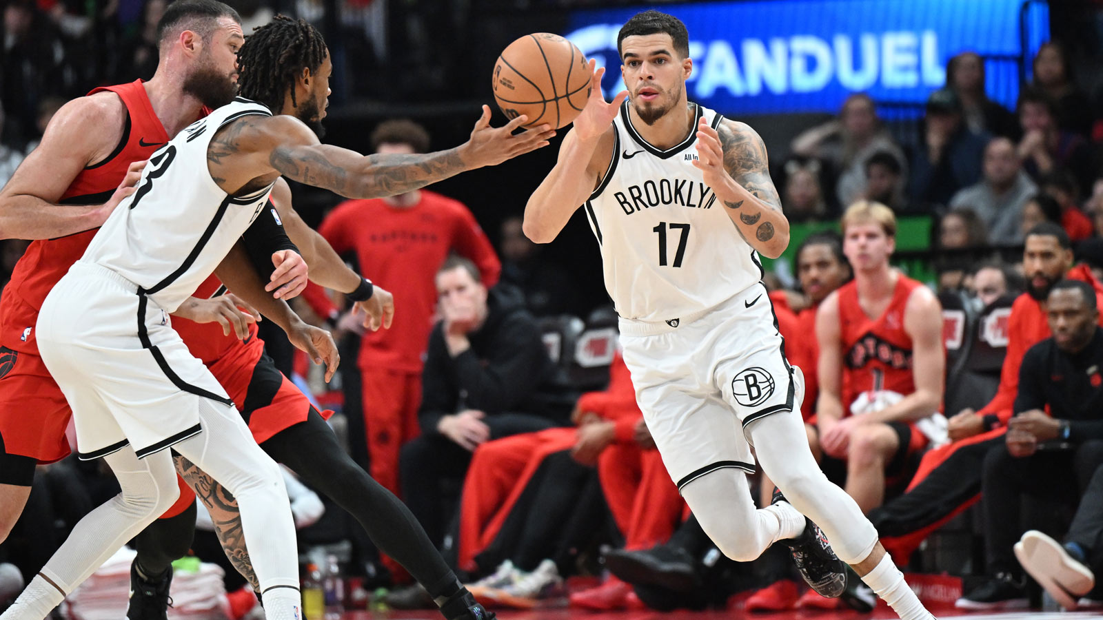 Brooklyn Nets forward Michael Porter Jr. (17) takes the ball from center Nic Claxton (33) in the second half against the Toronto Raptors at Scotiabank Arena.