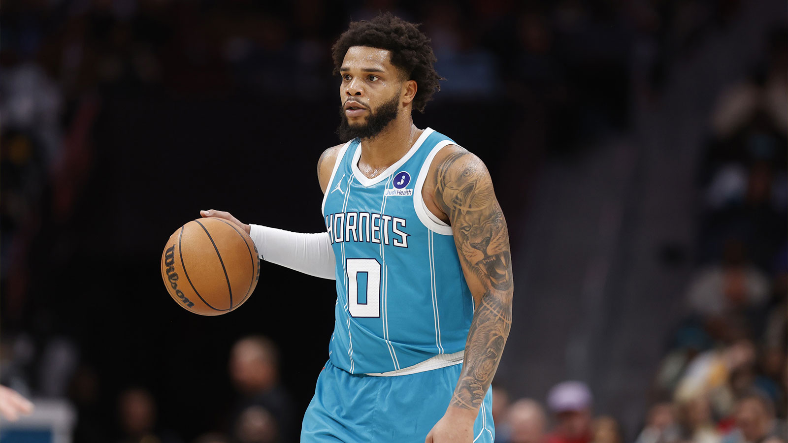Charlotte Hornets forward Miles Bridges (0) brings the ball up the court during the second half against the Los Angeles Lakers at Spectrum Center.