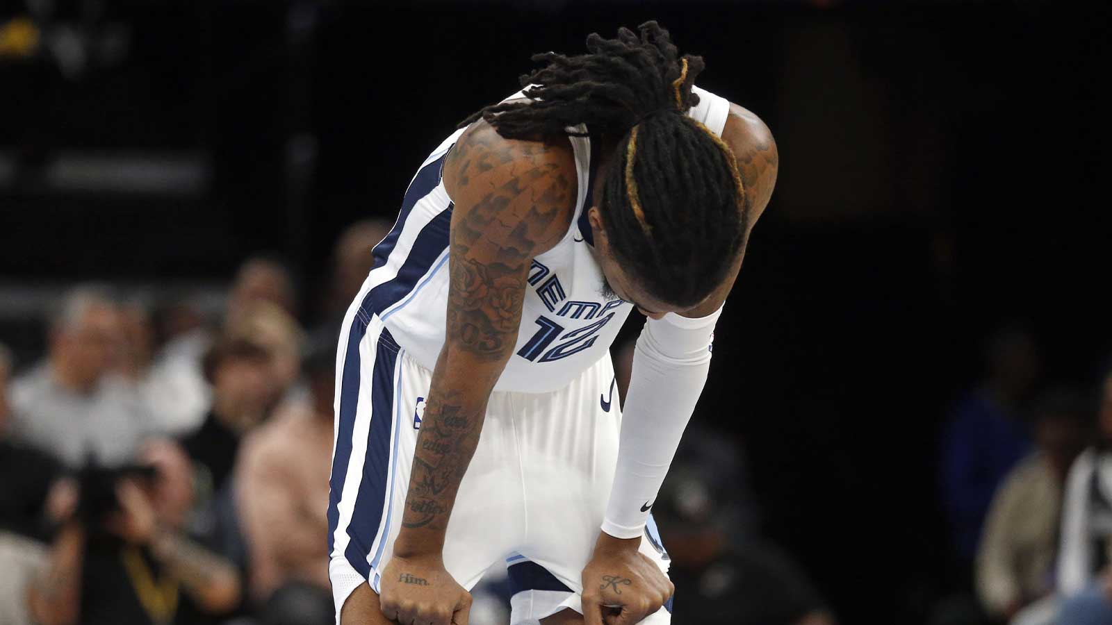 Memphis Grizzlies guard Ja Morant (12) reacts during the first quarter against the Houston Rockets at FedExForum.
