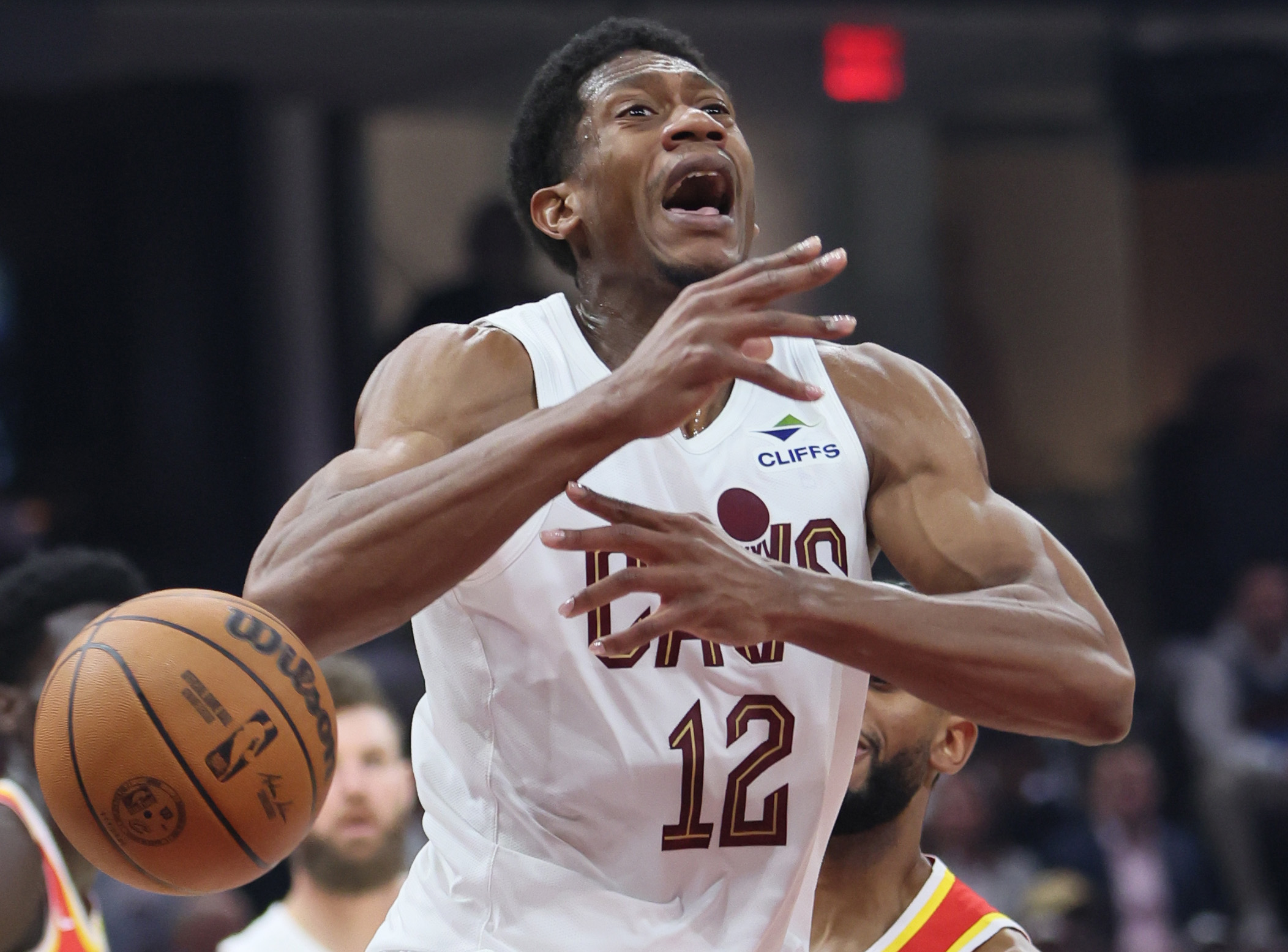 Cleveland Cavaliers forward De'Andre Hunter losses control of the basketball after being stripped by Atlanta Hawks guard Nickeil in the first half at Rocket Arena. 